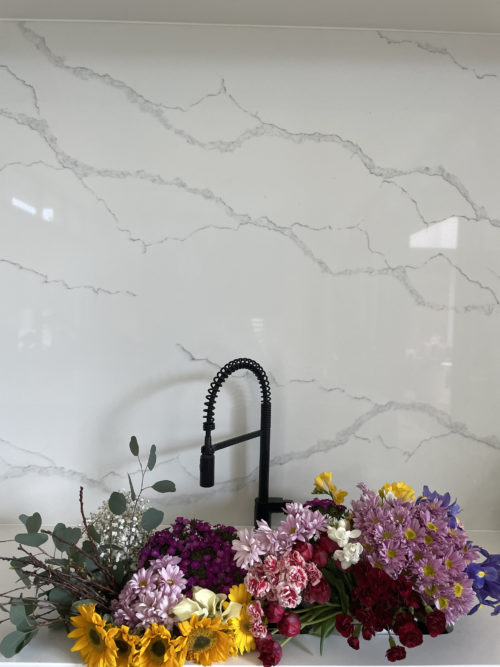 Flowers in the sink of a beautiful modern kitchen